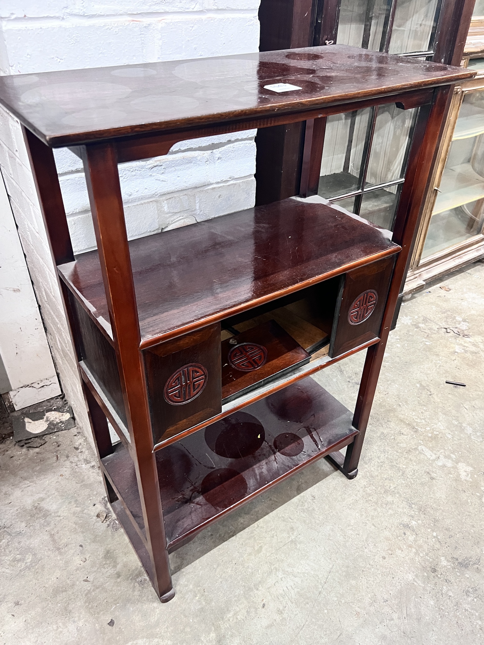 A Japanese hardwood three tier etagere, width 66cm, depth 31cm, height 98cm